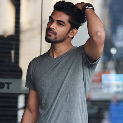 man gray t-shirt hand hair style